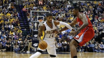 Jan 18, 2014; Indianapolis, IN, USA; Indiana Pacers forward Paul George (24) drives to the basket against Los Angeles Clippers center DeAndre Jordan (6) at Bankers Life Fieldhouse. Indiana defeats Los Angeles 106-92. Mandatory Credit: Brian Spurlock-USA TODAY Sports
