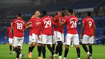 BRIGHTON, ENGLAND - JUNE 30: Paul Pogba of Manchester United congratulates Mason Greenwood on scoring the opening goal during the Premier League match between Brighton & Hove Albion and Manchester United at American Express Community Stadium on June 30, 2020 in Brighton, United Kingdom. (Photo by Mike Hewitt/Getty Images)