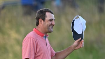 US golfer Scottie Scheffler waves on the 18th during his second round on day 2 of The 149th British Open Golf Championship at Royal St George's, Sandwich in south-east England on July 16, 2021. - RESTRICTED TO EDITORIAL USE (Photo by Paul ELLIS / AFP) / RESTRICTED TO EDITORIAL USE (Photo by PAUL ELLIS/AFP via Getty Images)