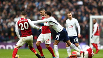 LONDON, ENGLAND - FEBRUARY 10: Dele Alli of Tottenham Hotspur clashes with Shkodran Mustafi of Arsenal during the Premier League match between Tottenham Hotspur and Arsenal at Wembley Stadium on February 10, 2018 in London, England. (Photo by Catherine Ivill/Getty Images)