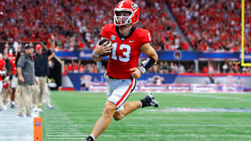 ATLANTA, GA - SEPTEMBER 03: Stetson Bennett #13 of the Georgia Bulldogs rushes in for a touchdown during the first half of the Chick-fil-A Kick-Off Game against the Oregon Ducks at Mercedes-Benz Stadium on September 3, 2022 in Atlanta, Georgia. (Photo by Todd Kirkland/Getty Images)