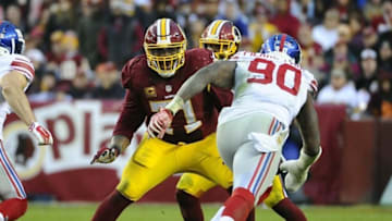Nov 29, 2015; Landover, MD, USA; Washington Redskins tackle Trent Williams (71) blocks New York Giants defensive end Jason Pierre-Paul (90) during the second half at FedEx Field. Washington Redskins won 20 - 14. Mandatory Credit: Brad Mills-USA TODAY Sports