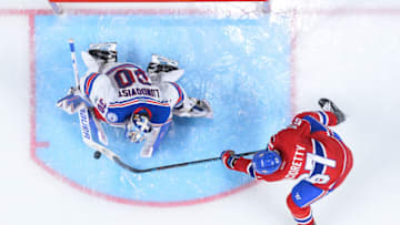 MONTREAL, QC - APRIL 14: Max Pacioretty #67 of the Montreal Canadiens is stopped by goaltender Henrik Lundqvist #30 of the New York Rangers in Game Two of the Eastern Conference First Round during the 2017 NHL Stanley Cup Playoffs at the Bell Centre on April 14, 2017 in Montreal, Quebec, Canada. The Montreal Canadiens defeated the New York Rangers 4-3 in overtime. (Photo by Minas Panagiotakis/Getty Images)