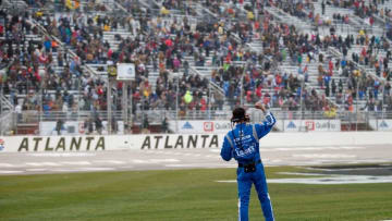 Mar 1, 2015; Hampton, GA, USA; The crew of NASCAR Sprint Cup Series driver Jimmie Johnson (48) celebrates Johnson winning the Folds of Honor QuikTrip 500 at Atlanta Motor Speedway. Mandatory Credit: Kevin Liles-USA TODAY Sports
