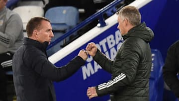 Leicester City's Northern Irish manager Brendan Rodgers (L) with Manchester United's Norwegian manager Ole Gunnar Solskjaer (C) (Photo by OLI SCARFF/POOL/AFP via Getty Images)