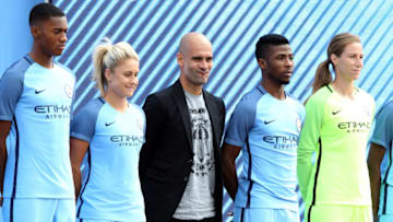 MANCHESTER, ENGLAND - JULY 03: Manchester City's new Manager Pep Guardiola (C) is unveiled with the clubs new kit during a media day at the Etihad campus on July 3, 2016 in Manchester, England. (Photo by Nigel Roddis/Getty Images)
