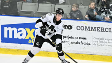BOISBRIAND, QC - APRIL 09: Alexis Gendron #12 of the Blainville-Boisbriand Armada looks to play the puck against the Baie-Comeau Drakkar during the second period at Centre d'Excellence Sports Rousseau on April 9, 2022 in Boisbriand, Canada. The Blainville-Boisbriand Armada defeated the Baie-Comeau Drakkar 6-1. (Photo by Minas Panagiotakis/Getty Images)