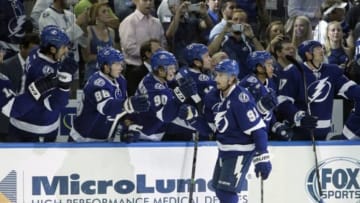 Oct 13, 2014; Tampa, FL, USA; Tampa Bay Lightning center Steven Stamkos (91) is congratulated by teammates after he scored against the Montreal Canadiens during the first period at Amalie Arena. Mandatory Credit: Kim Klement-USA TODAY Sports