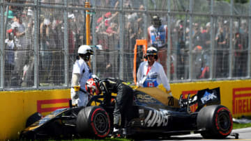MONTREAL, QUEBEC - JUNE 08: Kevin Magnussen of Denmark and Haas F1 climbs from his car after crashing during qualifying for the F1 Grand Prix of Canada at Circuit Gilles Villeneuve on June 08, 2019 in Montreal, Canada. (Photo by Dan Mullan/Getty Images)