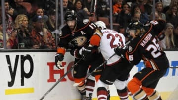 November 9, 2015; Anaheim, CA, USA; Anaheim Ducks center Ryan Kesler (17) plays for the puck as left wing Carl Hagelin (26) helps get the puck against Arizona Coyotes defenseman Oliver Ekman-Larsson (23) during the second period at Honda Center. Mandatory Credit: Gary A. Vasquez-USA TODAY Sports