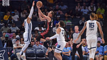 Duncan Robinson #55 of the Miami Heat goes to the basket against Tyus Jones #21 of the Memphis Grizzlies (Photo by Justin Ford/Getty Images)