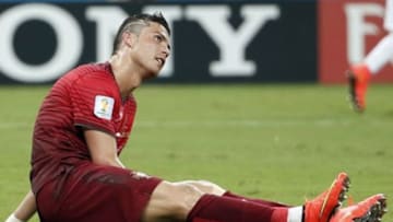 Jun 22, 2014; Manaus, Amazonas, BRAZIL; Portugal forward Cristiano Ronaldo (7) sits on the ground after being knocked down during the second half of a 2-2 tie with the United States in a 2014 World Cup game at Arena Amazonia. Mandatory Credit: Winslow Townson-USA TODAY Sports