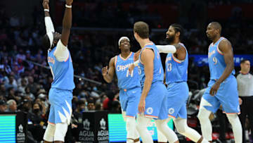 Nov 26, 2021; Los Angeles, California, USA; Los Angeles Clippers guard Reggie Jackson (1) celebrates a three-point basket by guard Paul George (13) as guard Terance Mann (14), guard Luke Kennard (5) and center Serge Ibaka (9) walk off the court for a time out in the second half against the Detroit Pistons at Staples Center. Mandatory Credit: Jayne Kamin-Oncea-USA TODAY Sports