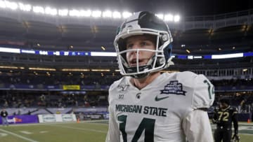 NEW YORK, NY - DECEMBER 27: Quarterback Brian Lewerke #14 of the Michigan State Spartans sfter defeating the Wake Forest Demon Deacons in the New Era Pinstripe Bowl at Yankee Stadium on December 27, 2019 in the Bronx borough of New York City. Michigan State Spartans won 27-21. (Photo by Adam Hunger/Getty Images)