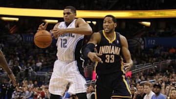 Feb 9, 2014; Orlando, FL, USA; Orlando Magic small forward Tobias Harris (12) defends Indiana Pacers small forward Danny Granger (33) during the second half at Amway Center. Orlando Magic defeated the Indiana Pacers 93-92. Mandatory Credit: Kim Klement-USA TODAY Sports