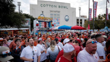 Fans pack the area around ESPN's College GameDay before the Red River Rivalry college football game between the University of Oklahoma Sooners (OU) and the University of Texas (UT) Longhorns at the Cotton Bowl in Dallas, Saturday, Oct. 7, 2023.