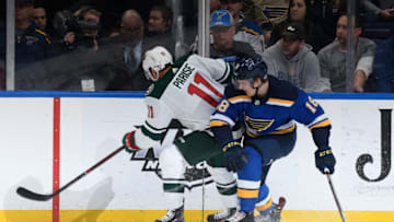 ST. LOUIS, MO - NOVEMBER 11: Zach Parise #11 of the Minnesota Wild and Robert Thomas #18 of the St. Louis Blues battle at Enterprise Center on November 11, 2018 in St. Louis, Missouri. (Photo by Scott Rovak/NHLI via Getty Images)