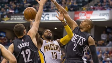 Jan 5, 2017; Indianapolis, IN, USA; Indiana Pacers forward Paul George (13) shoots the ball and is fouled by Brooklyn Nets guard Randy Foye (2) in the second quarter of the game at Bankers Life Fieldhouse. Mandatory Credit: Trevor Ruszkowski-USA TODAY Sports