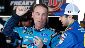 DOVER, DE - SEPTEMBER 29: Kevin Harvick, driver of the #4 Busch Beer Ford, speaks with Chase Elliott, driver of the #24 Mountain Dew Chevrolet, in the garage area during practice for the Monster Energy NASCAR Cup Series Apache Warrior 400 presented by Lucas Oil at Dover International Speedway on September 29, 2017 in Dover, Delaware. (Photo by Brian Lawdermilk/Getty Images)