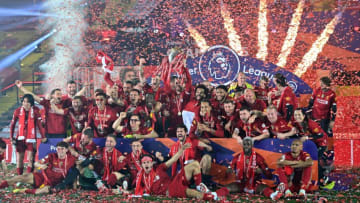 Liverpool lift the Premier League trophy for 2019/20 season (Photo by PAUL ELLIS/POOL/AFP via Getty Images)