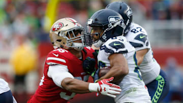 SANTA CLARA, CA - NOVEMBER 26: Doug Baldwin #75 of the Seattle Seahawks is tackled by Eric Reid #35 of the San Francisco 49ers at Levi's Stadium on November 26, 2017 in Santa Clara, California. (Photo by Lachlan Cunningham/Getty Images)