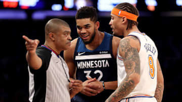 NEW YORK, NY - MARCH 23: Karl-Anthony Towns #32 of the Minnesota Timberwolves and Michael Beasley #8 of the New York Knicks have a conversation with an official in the third quarter during their game at Madison Square Garden on March 23, 2018 in New York City. NOTE TO USER: User expressly acknowledges and agrees that, by downloading and or using this photograph, User is consenting to the terms and conditions of the Getty Images License Agreement. (Photo by Abbie Parr/Getty Images)