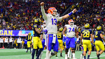 ATLANTA, GEORGIA - DECEMBER 29: Feleipe Franks #13 of the Florida Gators celebrates a third quarter touchdown by teammate Jordan Scarlett (not pictured) against the Michigan Wolverines during the Chick-fil-A Peach Bowl at Mercedes-Benz Stadium on December 29, 2018 in Atlanta, Georgia. (Photo by Scott Cunningham/Getty Images)