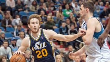 Apr 16, 2014; Minneapolis, MN, USA; Utah Jazz guard Gordon Hayward (20) dribbles in double overtime against the Minnesota Timberwolves forward Kevin Love (42) at Target Center. The Utah Jazz win 136-130 in double overtime. Mandatory Credit: Brad Rempel-USA TODAY Sports