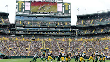 GREEN BAY, WISCONSIN - AUGUST 21: A general view as Kurt Benkert #7 of the Green Bay Packers prepares to hand off the ball against the New York Jets in the first half of a preseason game at Lambeau Field on August 21, 2021 in Green Bay, Wisconsin. (Photo by Patrick McDermott/Getty Images)
