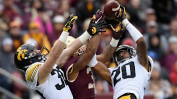 MINNEAPOLIS, MN - OCTOBER 06: Jake Gervase #30 and Julius Brents #20 of the Iowa Hawkeyes break up a pass intended for Chris Autman-Bell #3 of the Minnesota Golden Gophers during the second quarter of the game on October 6, 2018 at TCF Bank Stadium in Minneapolis, Minnesota. (Photo by Hannah Foslien/Getty Images)