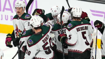 Nov 25, 2023; Las Vegas, Nevada, USA; Arizona Coyotes players celebrate after defeating the Vegas Golden Knights at T-Mobile Arena. Mandatory Credit: Stephen R. Sylvanie-USA TODAY Sports
