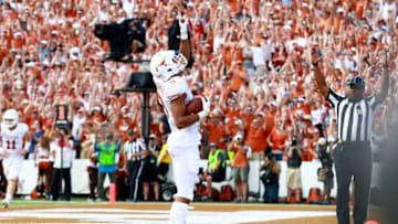 DALLAS, TX - OCTOBER 06: Collin Johnson #9 of the Texas Longhorns celebrates in the end zone after scoring a touchdown against the Oklahoma Sooners in the first half of the 2018 AT&T Red River Showdown at Cotton Bowl on October 6, 2018 in Dallas, Texas. (Photo by Tom Pennington/Getty Images)