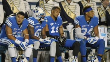 PROVO, UT - OCTOBER 3: Brigham Young Cougar players sit on the bench at the start of the fourth quarter against the Utah State Aggies at LaVell Edwards Stadium on October 3, 2014 in Provo, Utah. (Photo by Gene Sweeney Jr/Getty Images )