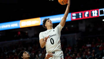 Cincinnati Bearcats guard Daniel Skillings scores against Cleveland State at Fifth Third Arena. The Enquirer.