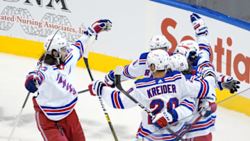 TORONTO, ONTARIO - AUGUST 03: Artemi Panarin #10 of the New York Rangers celebrates with Mika Zibanejad #93, Chris Kreider #20, and Ryan Strome #16 after scoring a goal against the Carolina Hurricanes in Game Two of the Eastern Conference Qualification Round prior to the 2020 NHL Stanley Cup Playoffs at Scotiabank Arena on August 3, 2020 in Toronto, Ontario, Canada. (Photo by Andre Ringuette/Freestyle Photo/Getty Images)