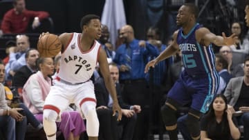 Apr 5, 2016; Toronto, Ontario, CAN; Toronto Raptors guard Kyle Lowry (7) looks to play a ball as Charlotte Hornets guard Kemba Walker (15) tries to defend during the first quarter in a game at Air Canada Centre. Mandatory Credit: Nick Turchiaro-USA TODAY Sports
