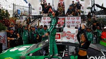 DOVER, DELAWARE - OCTOBER 06: Kyle Larson, driver of the #42 Clover Chevrolet, celebrates in Victory Lane after winning the Monster Energy NASCAR Cup Series Drydene 400 at Dover International Speedway on October 06, 2019 in Dover, Delaware. (Photo by Jeff Zelevansky/Getty Images)