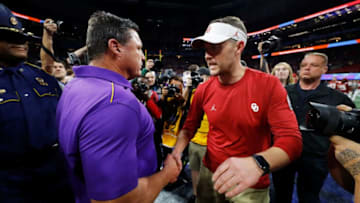 ATLANTA, GEORGIA - DECEMBER 28: Head coach Lincoln Riley of the Oklahoma Sooners and head coach Ed Orgeron of the LSU Tigers shake hands after the LSU Tigers win the Chick-fil-A Peach Bowl 28-63 at Mercedes-Benz Stadium on December 28, 2019 in Atlanta, Georgia. (Photo by Kevin C. Cox/Getty Images)