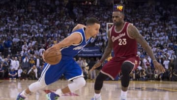 December 25, 2015; Oakland, CA, USA; Golden State Warriors guard Stephen Curry (30, left) dribbles the basketball against Cleveland Cavaliers forward LeBron James (23) in the fourth quarter of a NBA basketball game on Christmas at Oracle Arena. The Warriors defeated the Cavaliers 89-83. Mandatory Credit: Kyle Terada-USA TODAY Sports