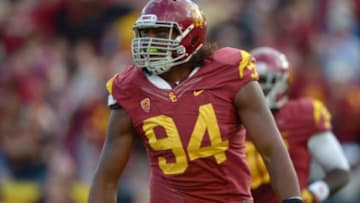Nov 10, 2012; Los Angeles, CA, USA; Southern California Trojans defensive end Leonard Williams (94) celebrates after intercepting a pass in the fourth quarter against the Arizona State Wildcats at the Los Angeles Memorial Coliseum. USC defeated Arizona State 38-17. Mandatory Credit: Kirby Lee/Image of Sport-USA TODAY Sports