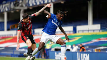 Bournemouth's Spanish defender Diego Rico (L) fights for the ball with Everton's Italian midfielder Moise Kean during the English Premier League football match between Everton and Bournemouth at Goodison Park in Liverpool, north west England on July 26, 2020. (Photo by Clive Brunskill / POOL / AFP) / RESTRICTED TO EDITORIAL USE. No use with unauthorized audio, video, data, fixture lists, club/league logos or 'live' services. Online in-match use limited to 120 images. An additional 40 images may be used in extra time. No video emulation. Social media in-match use limited to 120 images. An additional 40 images may be used in extra time. No use in betting publications, games or single club/league/player publications. / (Photo by CLIVE BRUNSKILL/POOL/AFP via Getty Images)