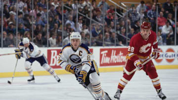 Alexander Mogilny #89 from Russia and Captain, Right Wing for the Buffalo Sabres in motion on the ice skating past #28 Paul Ranheim of the Calgary Flames during their NHL Eastern Conference Northeast Division game on 10th December 1993 at the Buffalo Memorial Auditorium in Buffalo, New York, United States. The Buffalo Sabres won the game 6 - 2. (Photo by Rick Stewart/Allsport/Getty Images)