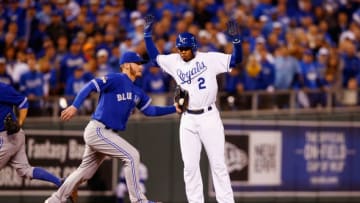 KANSAS CITY, MO - OCTOBER 16: Alcides Escobar #2 of the Kansas City Royals is tagged out after being caught in a rundown by Josh Donaldson #20 of the Toronto Blue Jays in the first inning during game one of the American League Championship Series between the Kansas City Royals and the Toronto Blue Jays at Kauffman Stadium on October 16, 2015 in Kansas City, Missouri. (Photo by Jamie Squire/Getty Images)