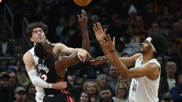 Cleveland Cavaliers forward Cedi Osman (16) and center Jarrett Allen (31) go for a rebound against Miami Heat center Bam Adebayo (13)(Ken Blaze-USA TODAY Sports)