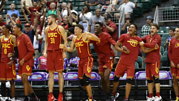 HONOLULU, HI - DECEMBER 25: The USC Trojan bench celebrates after Bennie Boatwright #25 hit a three point shot during the final seconds of the championship game against the New Mexico State Aggies of the Diamond Head Classic at the Stan Sheriff Center on December 25, 2017 in Honolulu, Hawaii. (Photo by Darryl Oumi/Getty Images)
