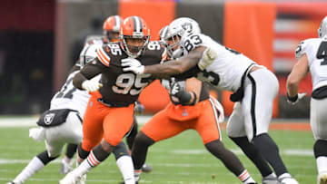 CLEVELAND, OHIO - NOVEMBER 01: Defensive end Myles Garrett #95 of the Cleveland Browns runs around tight end Darren Waller #83 of the Las Vegas Raiders during the second quarter at FirstEnergy Stadium on November 01, 2020 in Cleveland, Ohio. (Photo by Jason Miller/Getty Images)
