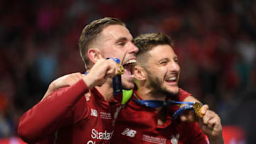 MADRID, SPAIN - JUNE 01: Jordan Henderson and Adam Lallana of Liverpool celebrate victory after the UEFA Champions League Final between Tottenham Hotspur and Liverpool at Estadio Wanda Metropolitano on June 01, 2019 in Madrid, Spain. (Photo by Matthias Hangst/Getty Images)