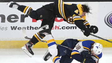 BOSTON, MASSACHUSETTS - MAY 27: Torey Krug #47 of the Boston Bruins checks Robert Thomas #18 of the St. Louis Blues during the third period in Game One of the 2019 NHL Stanley Cup Final at TD Garden on May 27, 2019 in Boston, Massachusetts. (Photo by Patrick Smith/Getty Images)
