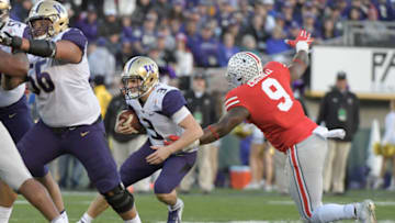 Jan 1, 2019; Pasadena, CA, USA; Washington Huskies quarterback Jake Browning (3) runs against Ohio State Buckeyes defensive end Jashon Cornell (9) in the third quarter in the 2019 Rose Bowl at Rose Bowl Stadium. Mandatory Credit: Kirby Lee-USA TODAY Sports