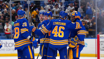 BUFFALO, NY - OCTOBER 13: Ilya Lyubushkin #46 of the Buffalo Sabres congratulates goaltender Craig Anderson #41 after they defeated the Ottawa Senators at KeyBank Center on October 13, 2022 in Buffalo, New York. (Photo by Kevin Hoffman/Getty Images)